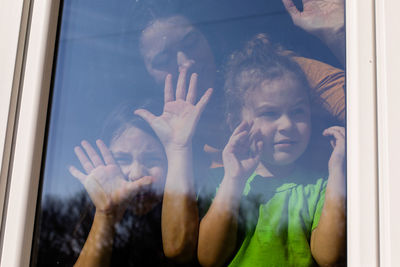 People looking through glass window