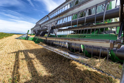 Panoramic view of agricultural field against sky