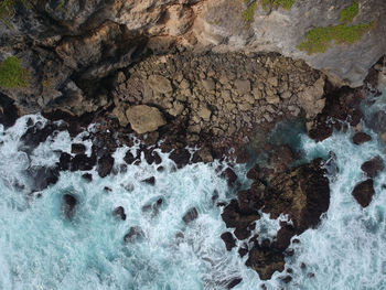 High angle view of rock formation in sea