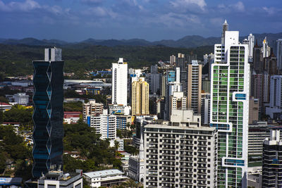 Modern buildings in city against sky