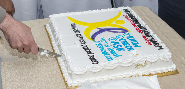 Midsection of person holding cake