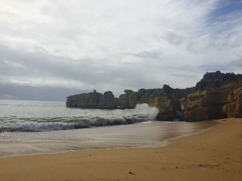 Scenic view of beach against sky