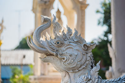 Close-up of statue against building