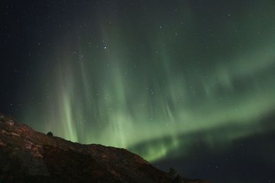 Low angle view of mountain against sky at night