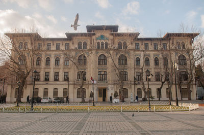 Facade of historic building against sky