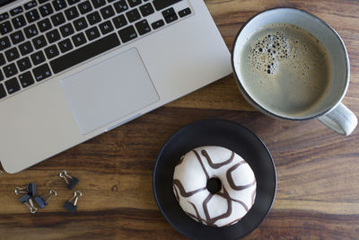 High angle view of coffee cup on table