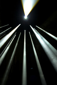 Low angle view of illuminated lights at night