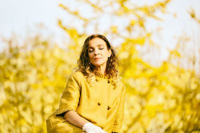 Woman resting in the park during autumn