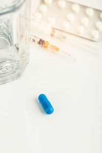 High angle view of blue glass on table