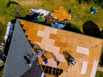 High angle view of people on building during sunny day