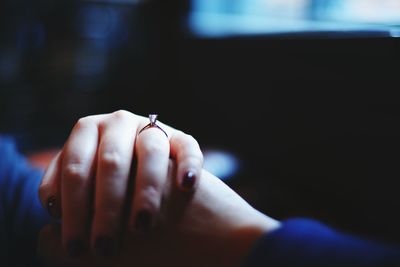 Close-up of cropped couple hands