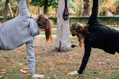 Mid adult women exercising at park