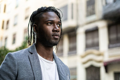 Portrait of young man looking away