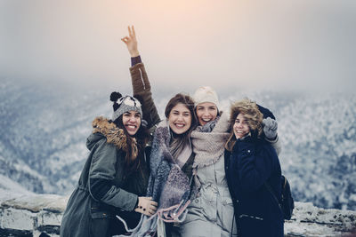 People on snow covered landscape during winter