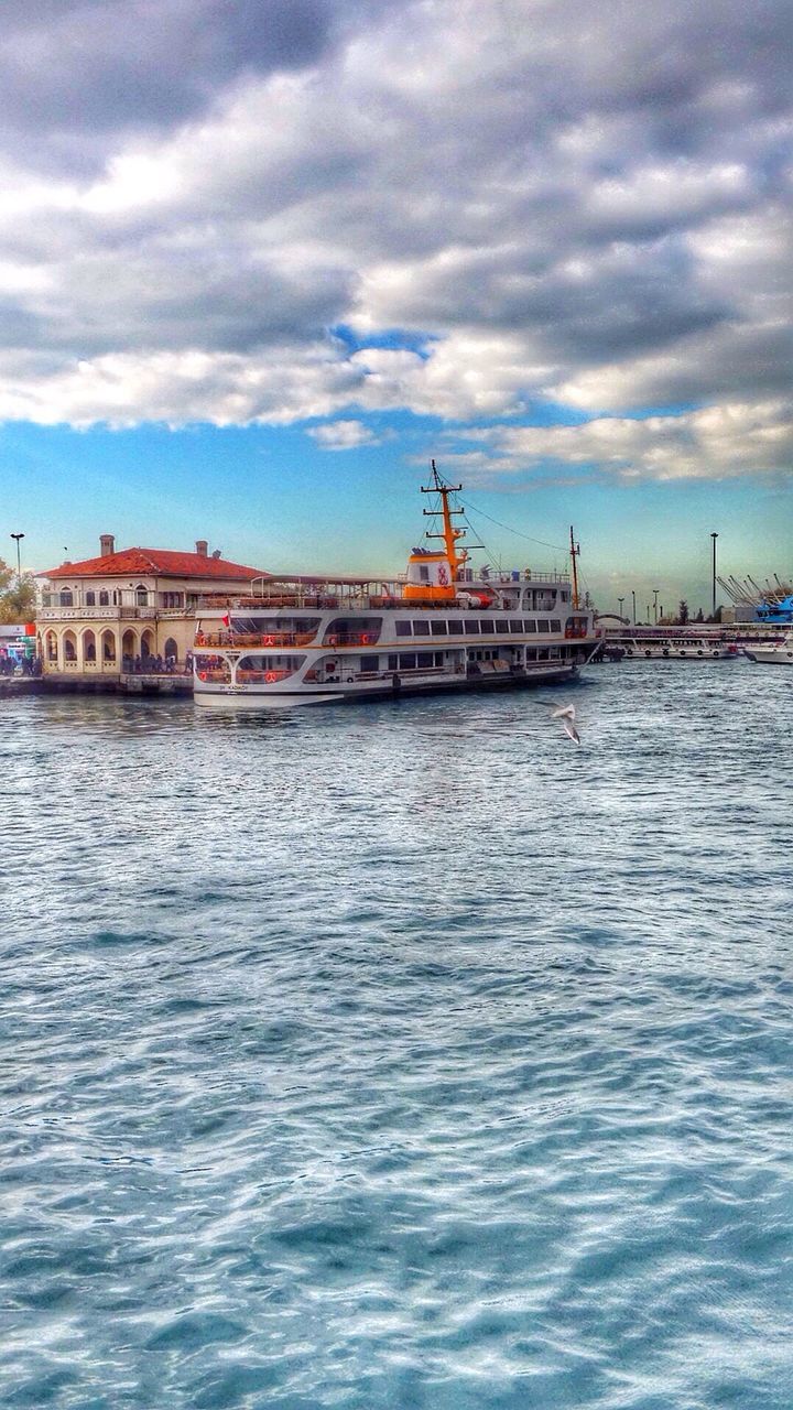 water, sky, waterfront, architecture, built structure, cloud - sky, sea, building exterior, cloudy, rippled, nautical vessel, cloud, transportation, river, nature, mode of transport, outdoors, boat, overcast, pier