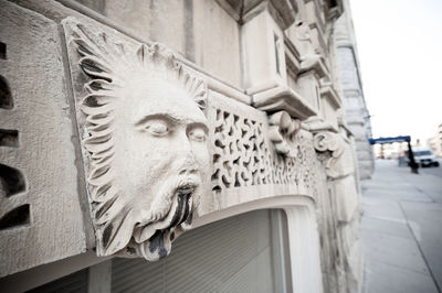 Close-up of sculpture against building