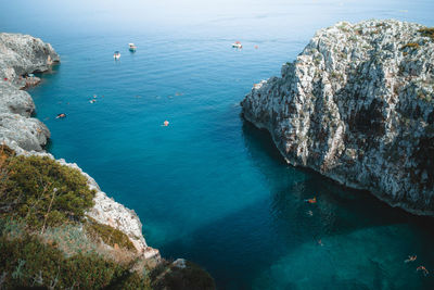 High angle view of rocks in sea