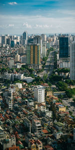 High angle view of buildings in city against sky