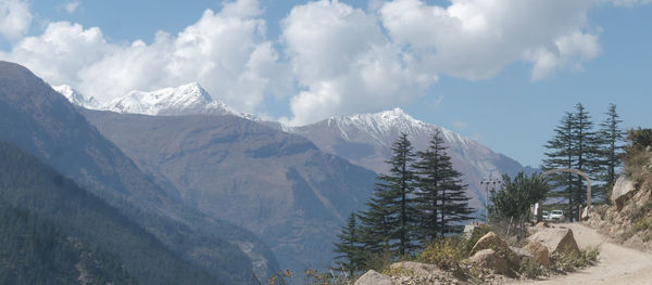 Panoramic view of snowcapped mountains against sky