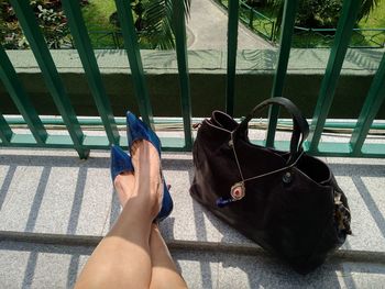 Low section of woman relaxing on floor