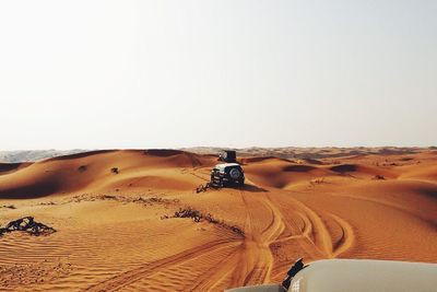 Sport utility vehicle on desert during sunny day