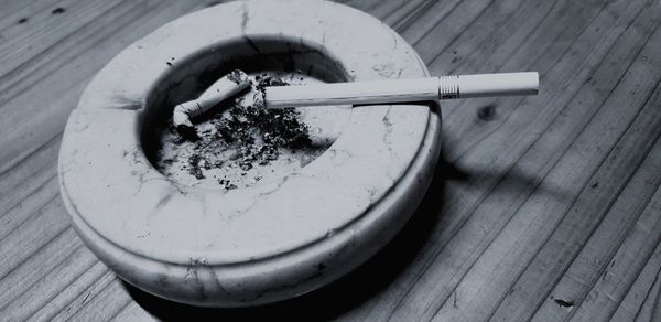 Close-up of cigarette on table