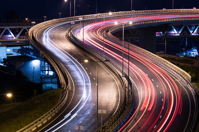 High angle view of light trails on road at night