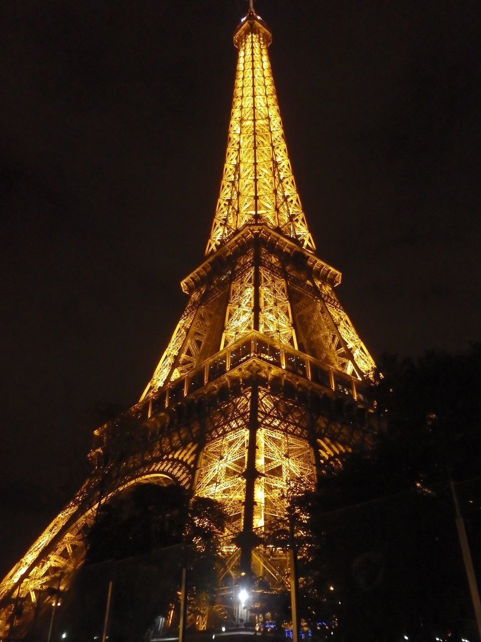 LOW ANGLE VIEW OF ILLUMINATED BUILDING AGAINST SKY