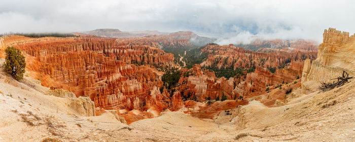 Panoramic view of landscape with mountain range in background