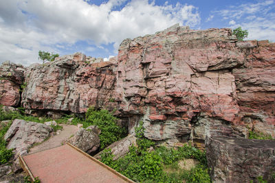 View of rock formation on mountain against sky