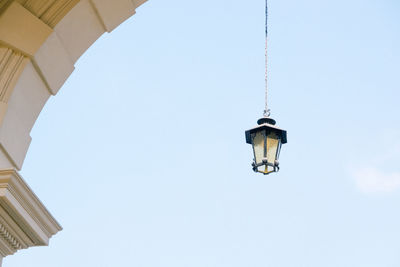 Low angle view of street light against building