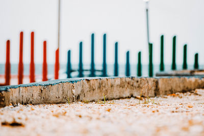 Close-up of fence on beach