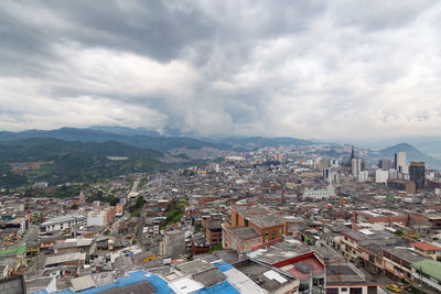 Aerial view of town against sky