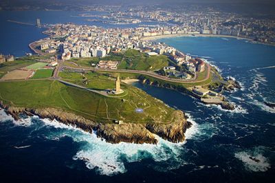 High angle view of buildings by sea