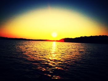 Scenic view of sea against clear sky during sunset