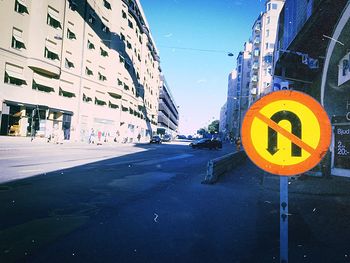 Road sign in front of building
