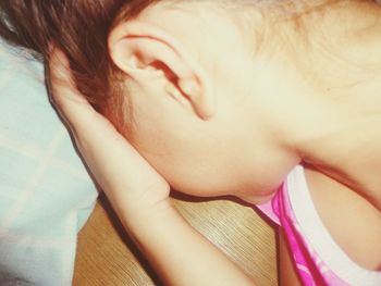 Close-up of woman with arms raised