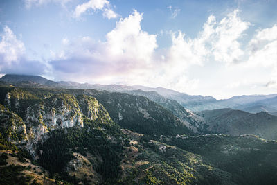 Scenic view of mountains against cloudy sky