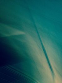 Low angle view of trees against blue sky