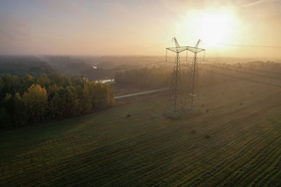 Scenic view of field against sky during sunset