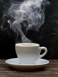 Close-up of coffee cup on table