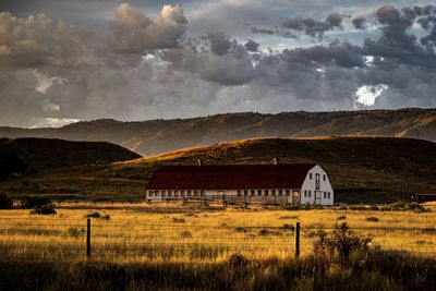 House on field against sky