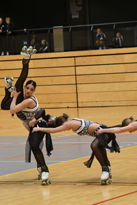 Full length of woman playing with ball