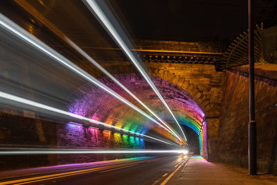 High angle view of light trails on road at night