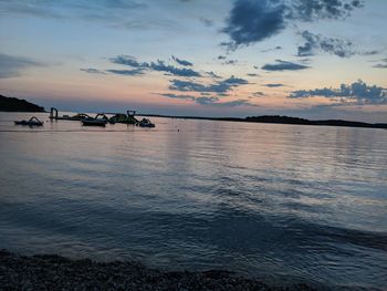 Scenic view of sea against sky at sunset