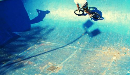 High angle view of man cycling at skateboard park