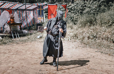 View of warrior standing on field