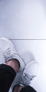 Low section of woman sitting on floor