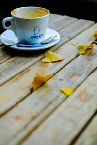 Close-up of tea cup on wood