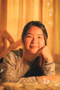 Portrait of a smiling woman sitting at table